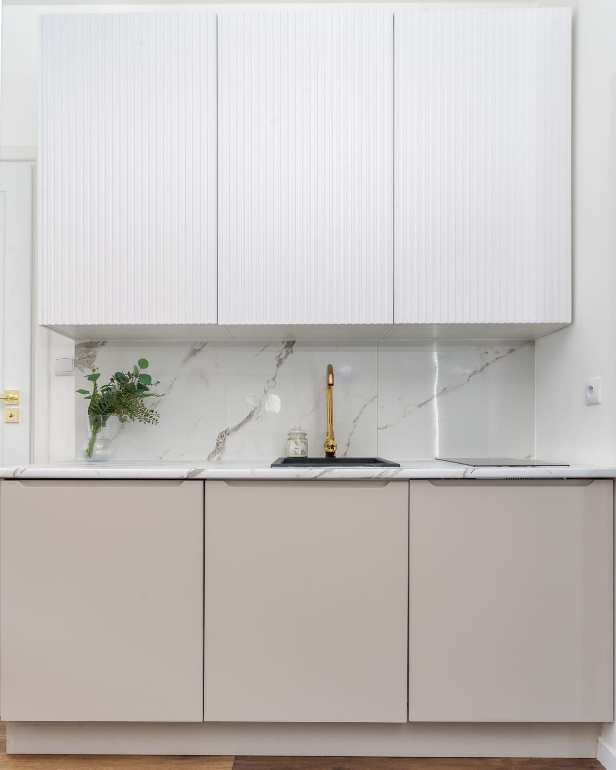 A bright marble galley kitchen