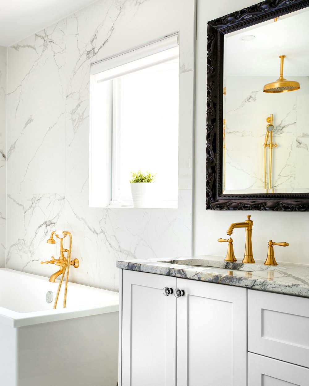 A finished en-suite bathroom with a walk-in shower and stone tiling